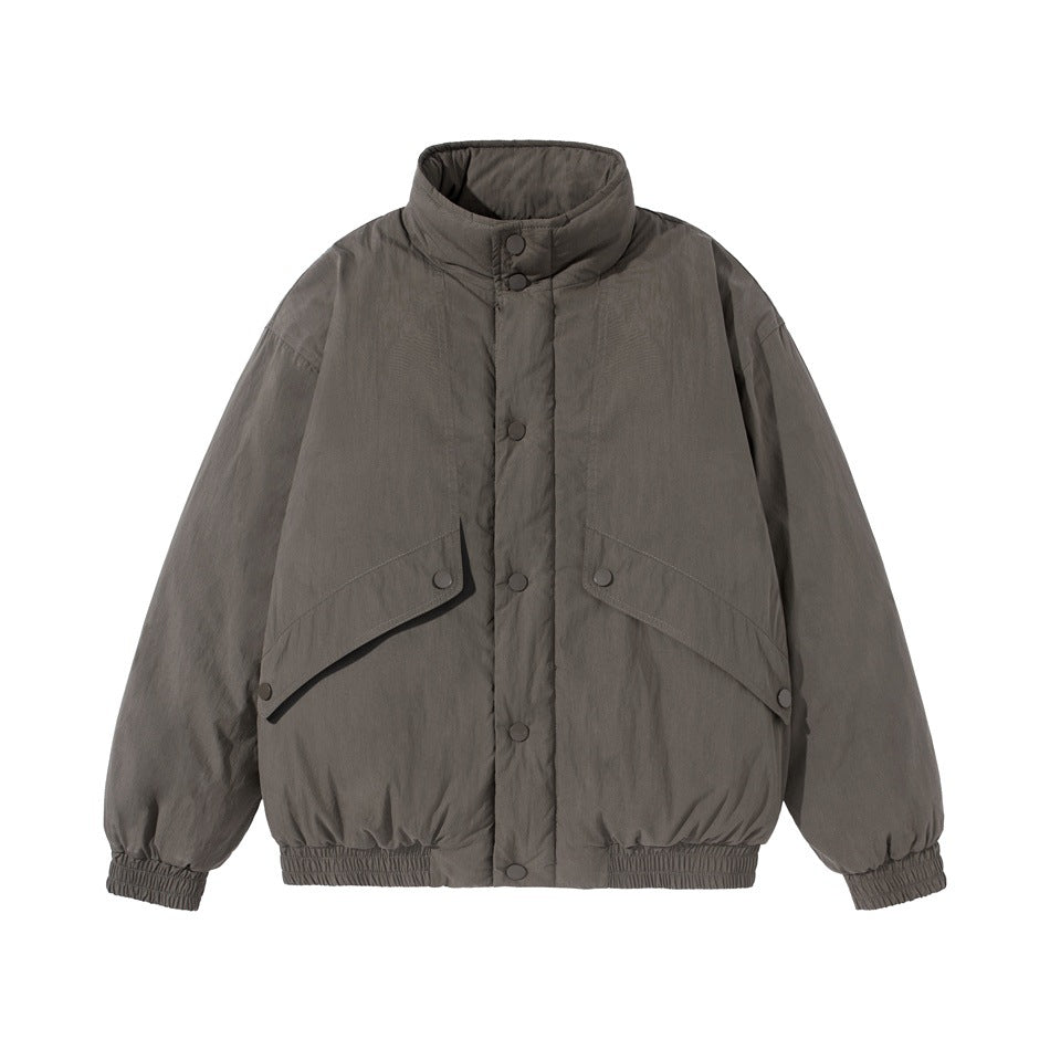 Dark gray stand-collar padded jacket, front flat lay, with snap placket, angled flap pockets and elastic hem