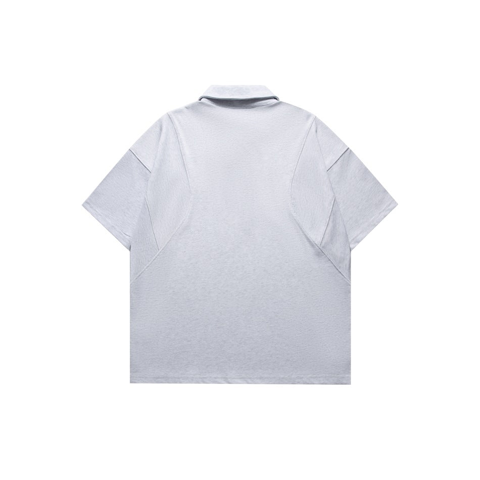 Back view of a light gray short-sleeve polo shirt with a collar and curved seam panels.