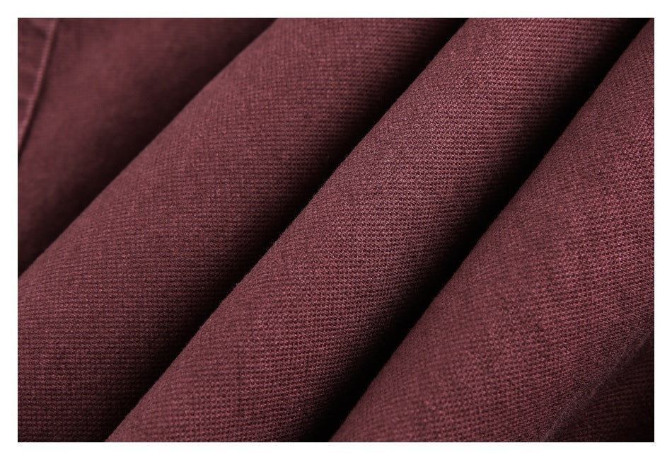 Close-up of the burgundy garment's textured fabric.