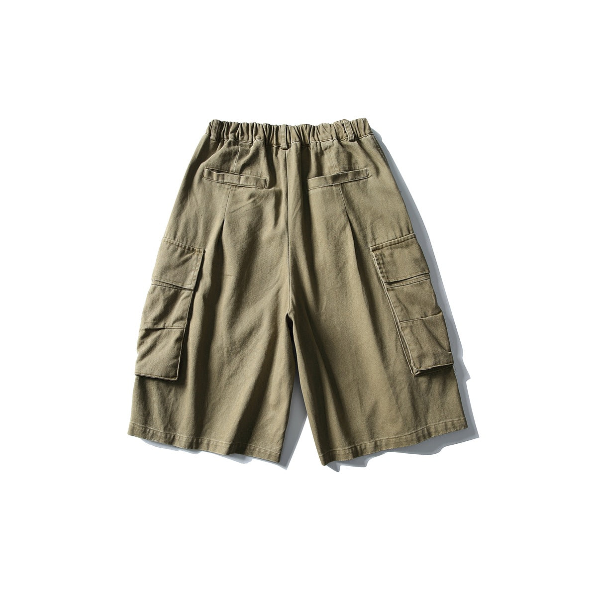 Back view of khaki cargo shorts with an elastic waistband, two rear pockets, and large side cargo pockets.