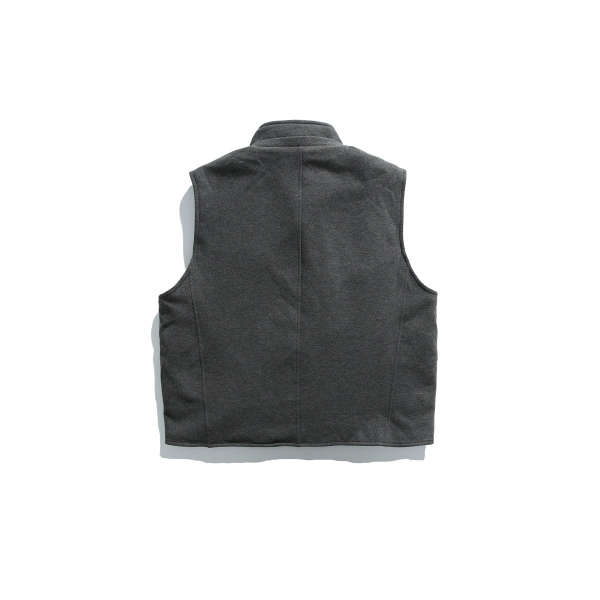 Back view of a charcoal sleeveless vest with a stand collar and center seam.