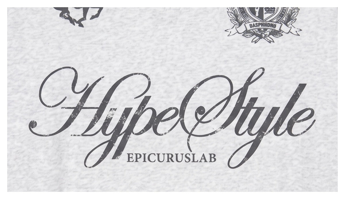 Close-up of a light gray marled garment with a large dark cursive “HypeStyle” graphic and smaller “EPICURUSLAB” text.