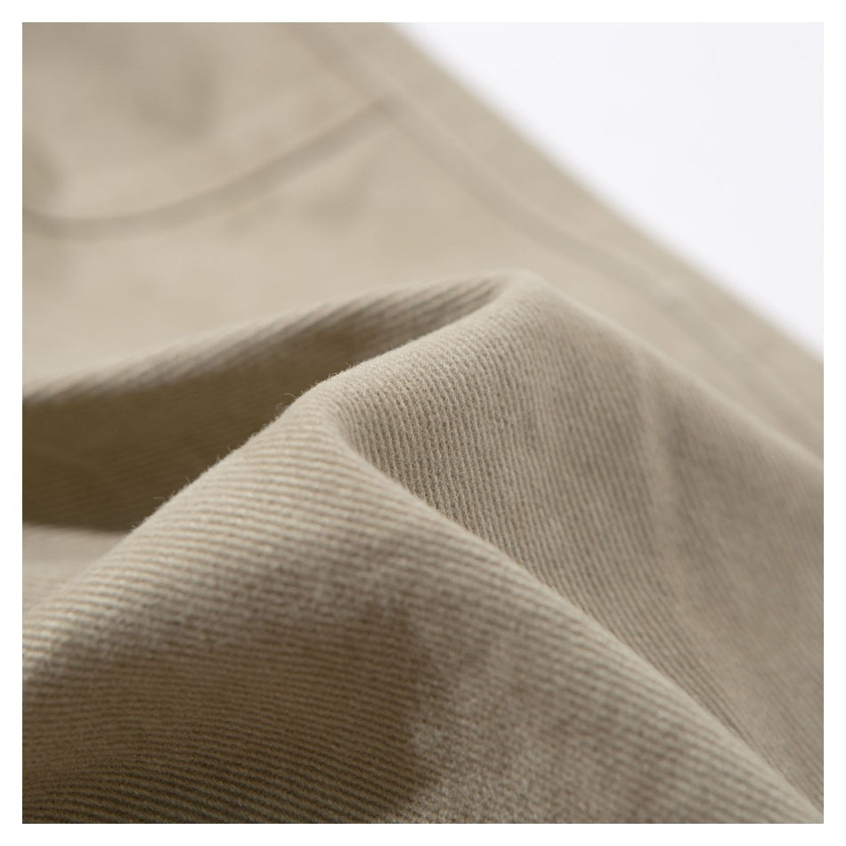 Macro view of the ridged texture of beige garment fabric.
