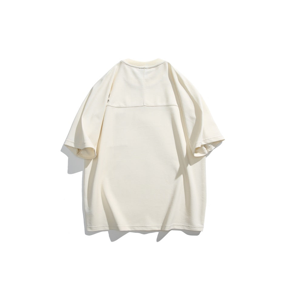 Back view of an off-white short-sleeve T-shirt laid flat against a white background.