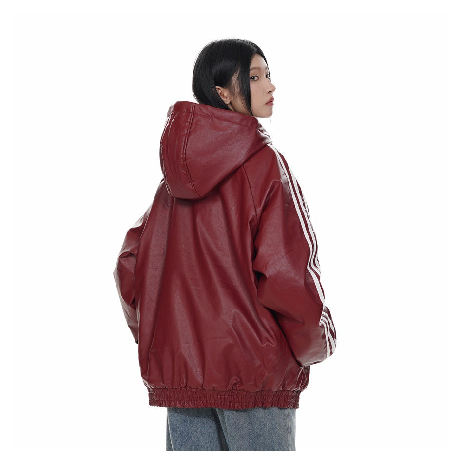 Rear view of a model wearing a burgundy hooded jacket with white sleeve stripes and an elastic hem.