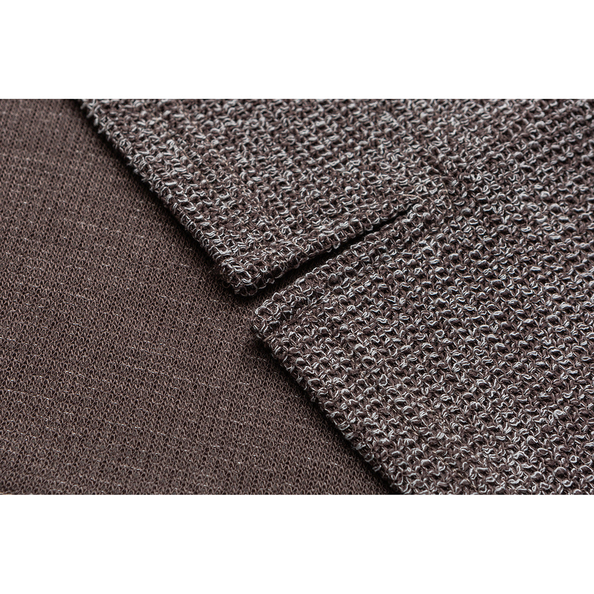 Close-up showing the textured brown-and-cream knit exterior and smoother inner side of the garment.