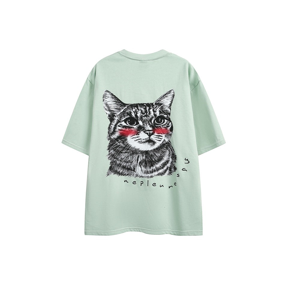 Mint green short-sleeve crew-neck T-shirt, back view with a cat face graphic and red cheek accents