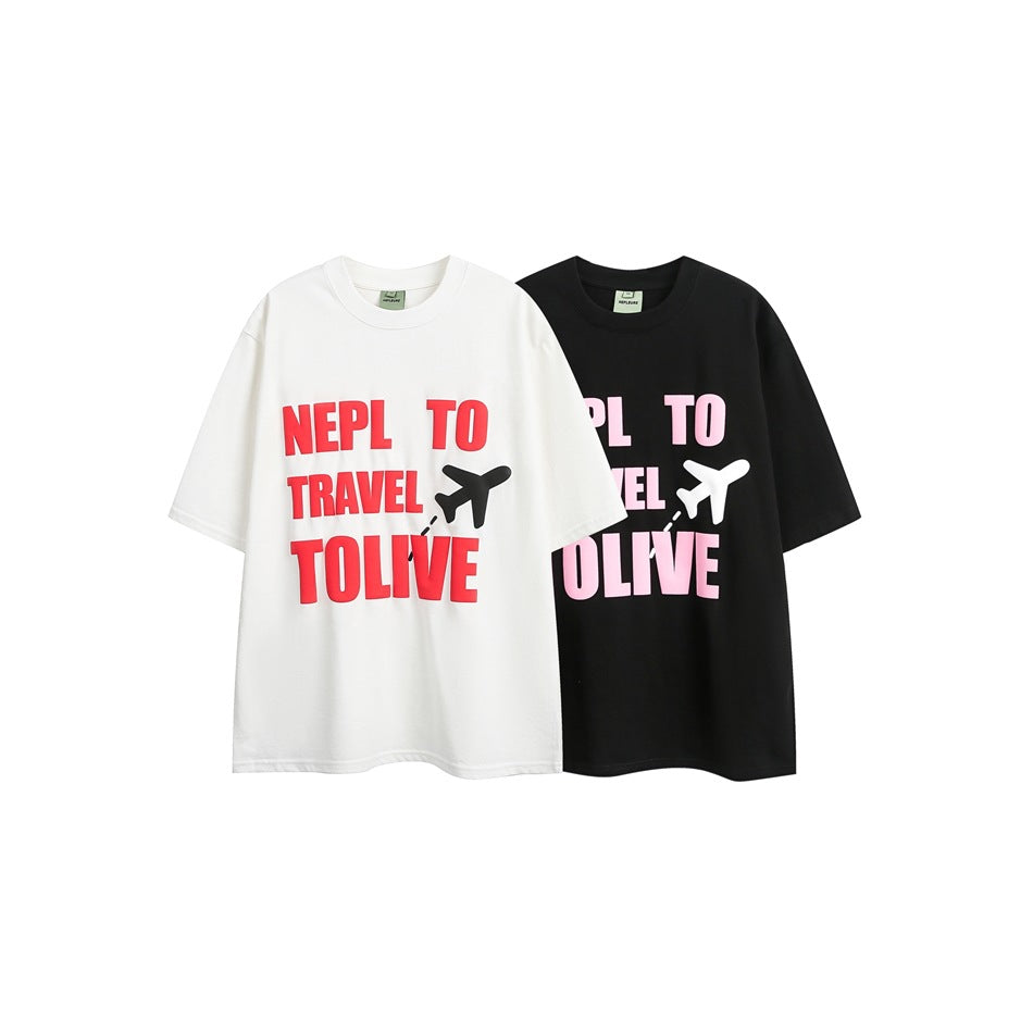 White and black short-sleeve crew-neck T-shirts shown from the front with colorful travel lettering and airplane graphics.