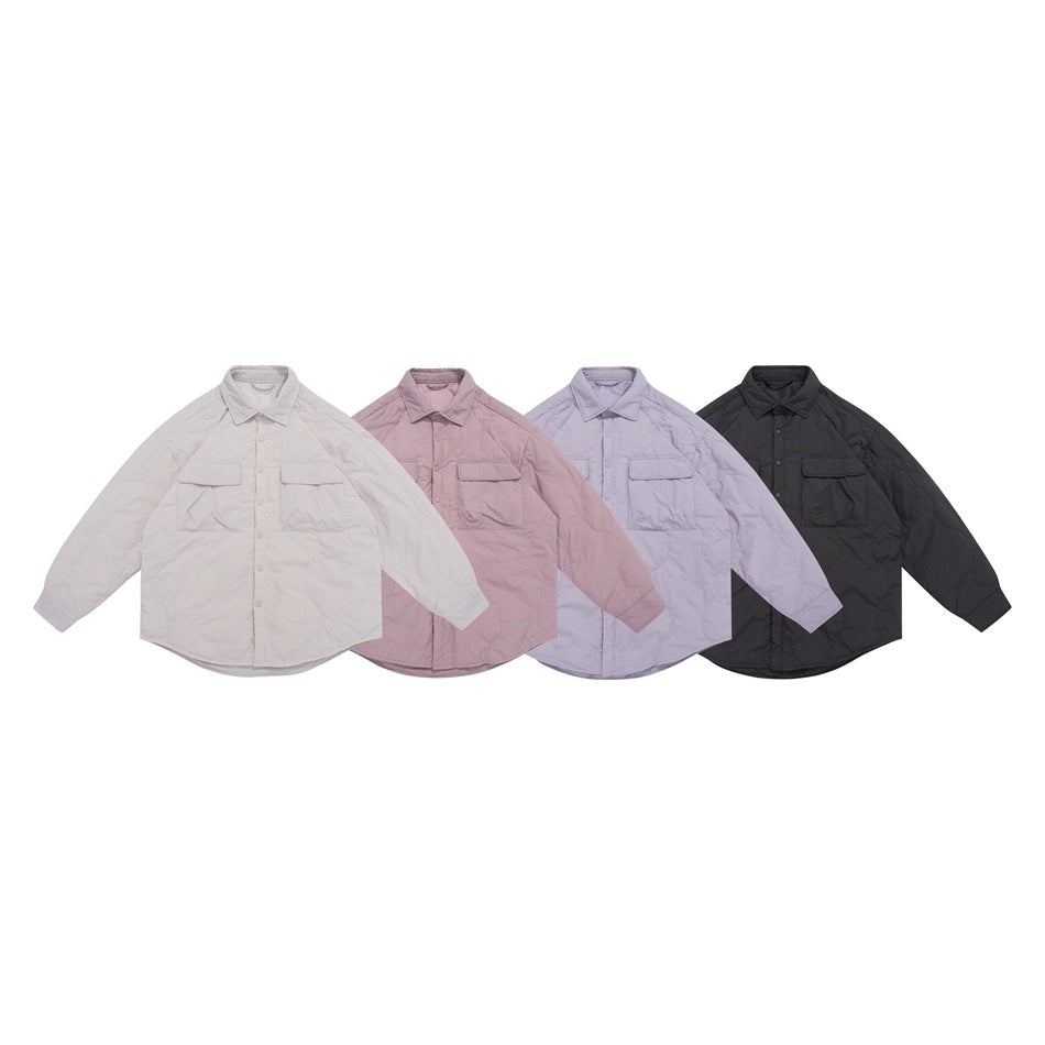 Four front-facing oversized utility shirts shown together in ivory, dusty mauve, lavender, and black.
