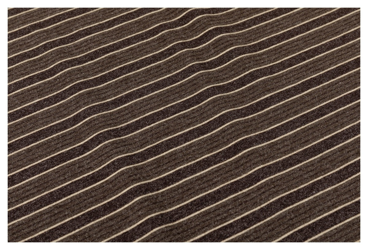 Close-up of dark brown fabric with thin, irregular cream diagonal stripes.