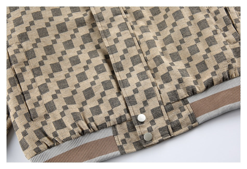 Close-up of the jacket's lower front, snap buttons, and striped ribbed hem.