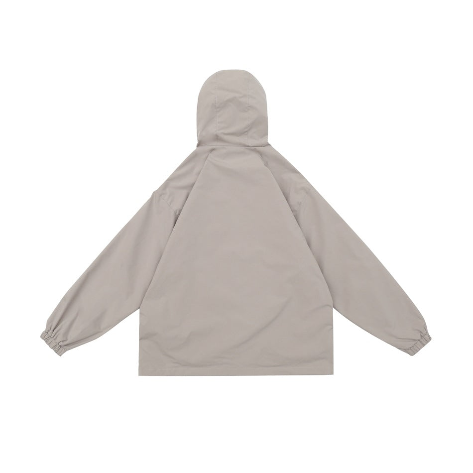 Rear view of a light gray hooded jacket with long sleeves and elastic cuffs.
