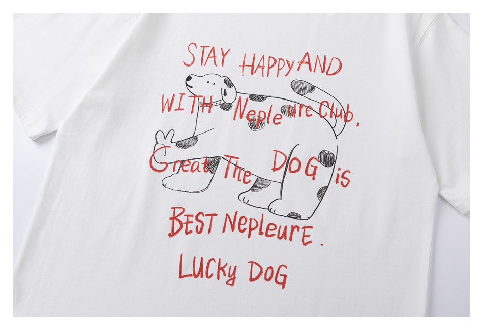Close view of a white T-shirt front with a hand-drawn spotted dog and red lettering.