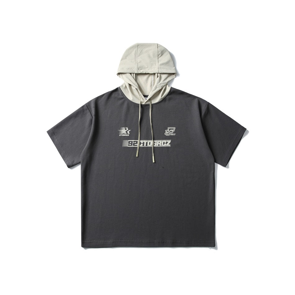 Dark gray short-sleeve hooded T-shirt with light beige hood, drawstrings and cream front prints, flat lay