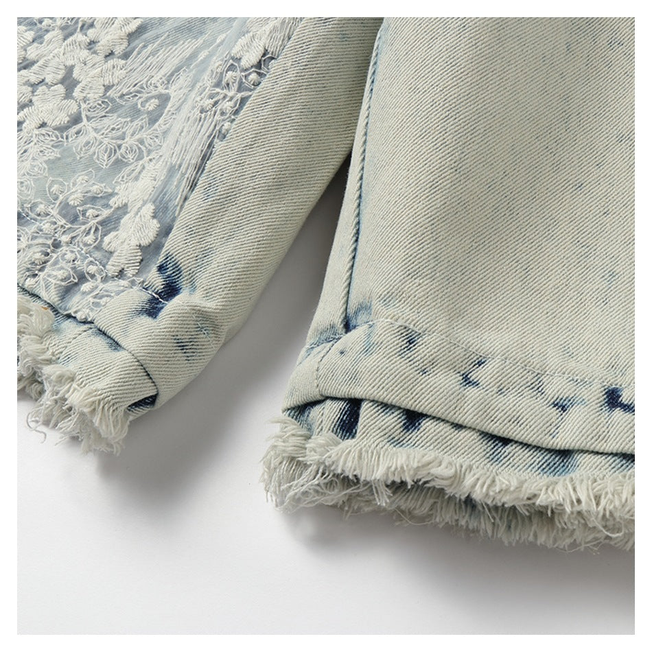 Close-up of two light-wash denim leg openings with folded hems and long frayed edges.