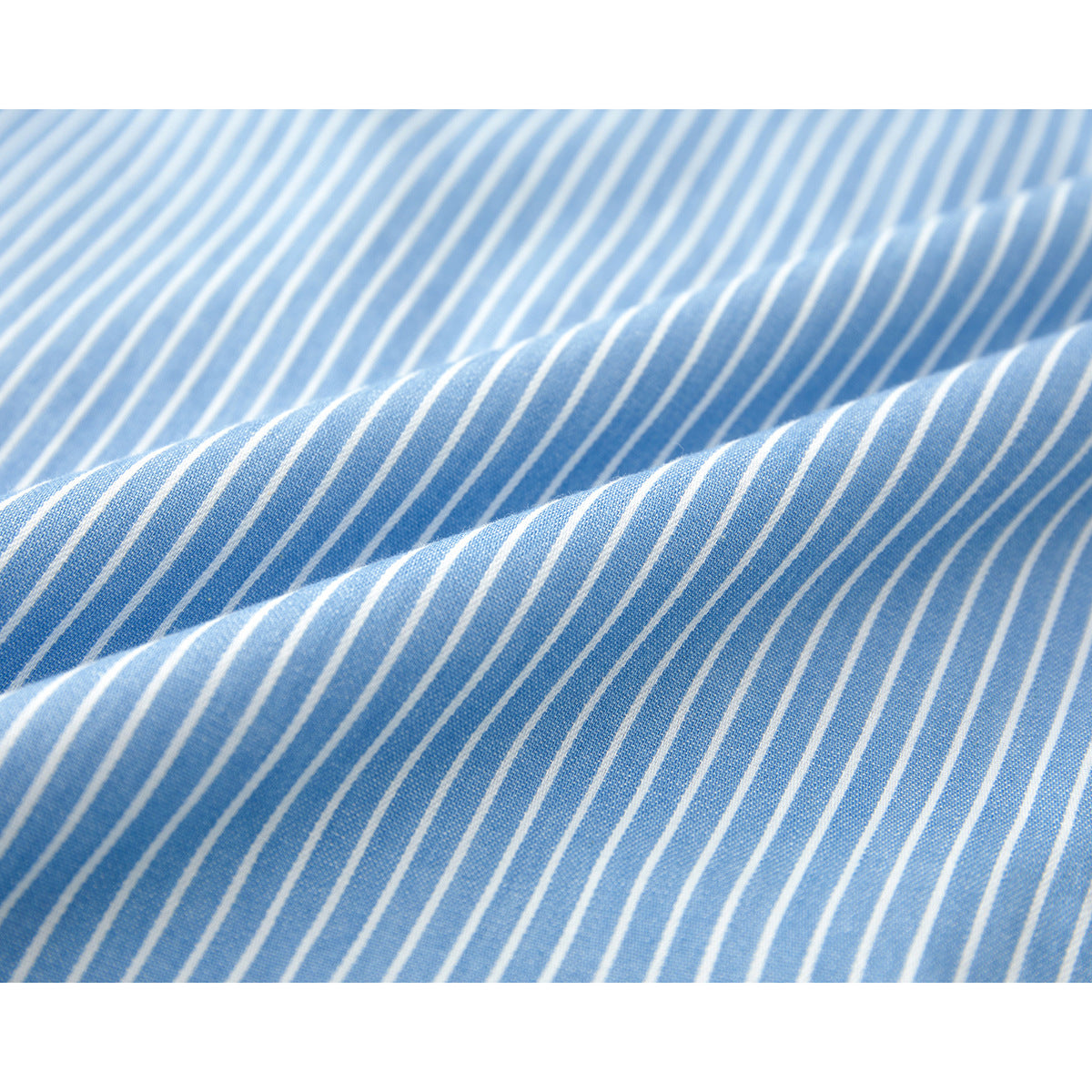 Close-up of light blue fabric with narrow white stripes and soft folds.