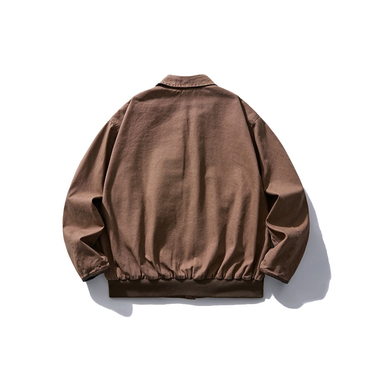 Back view of a brown collared jacket with long sleeves and a dark ribbed hem.