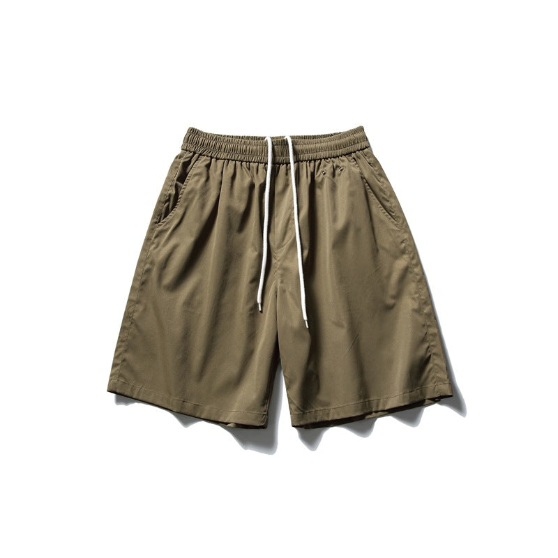 Olive green knee-length shorts with elastic drawstring waist and side pockets, flat lay front view