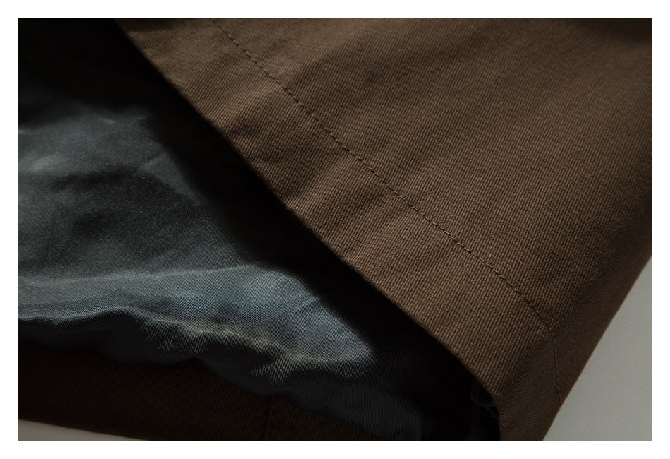 Close-up of a brown garment seam and dark inner lining.