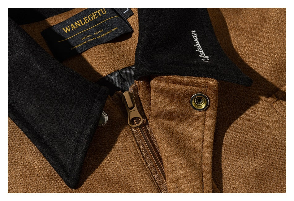 Close-up of a camel jacket's black collar, zipper, snap, and neck label.