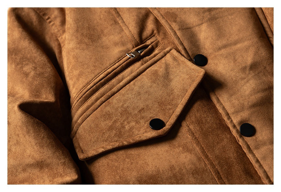 Close-up of a brown jacket's flap pocket, layered trim, and black front buttons.