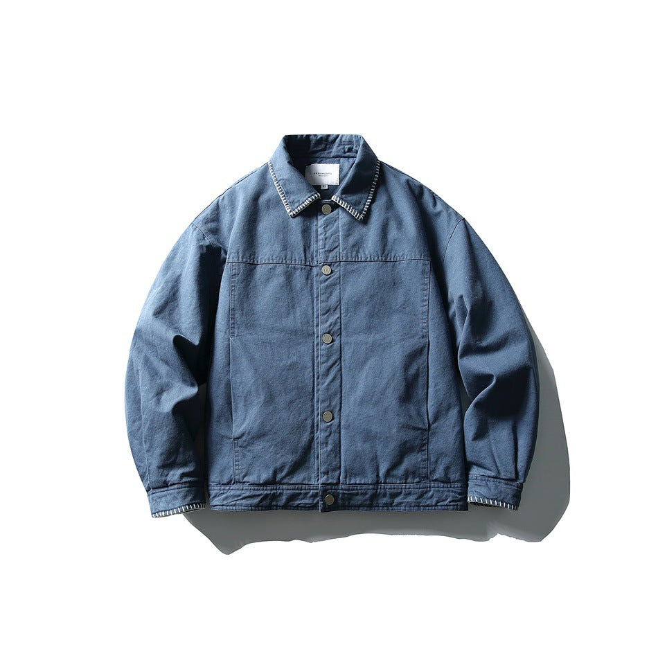 Blue collared jacket flat lay, front view, snap buttons, contrast stitched collar and cuffs