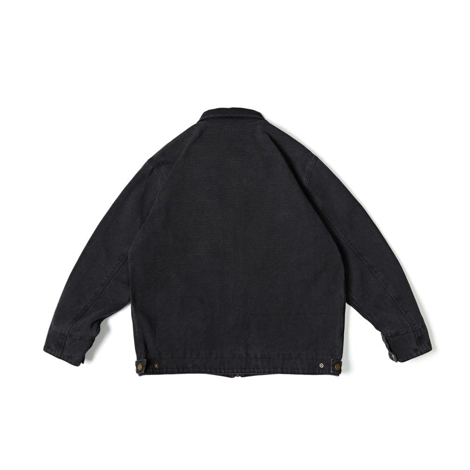 Back view of a black collared jacket with long sleeves and adjustable snap tabs at the hem.