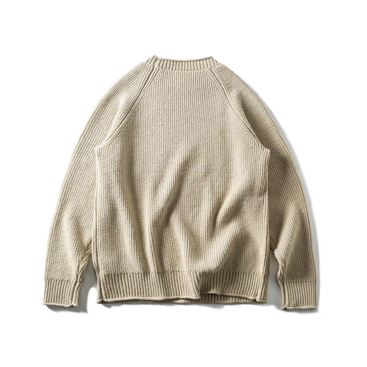 Back view of a cream rib-knit crew-neck sweater with raglan sleeves and ribbed cuffs and hem.