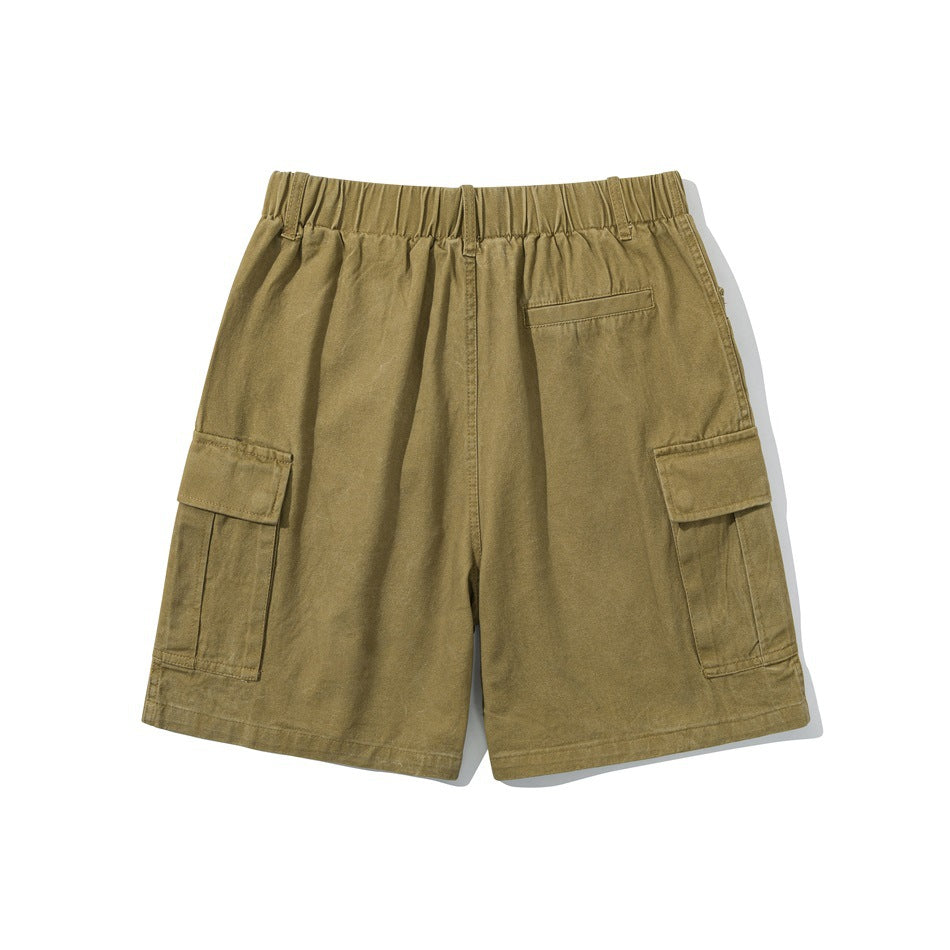 Back view of olive cargo shorts with an elastic waistband, rear pocket, and side cargo pockets.
