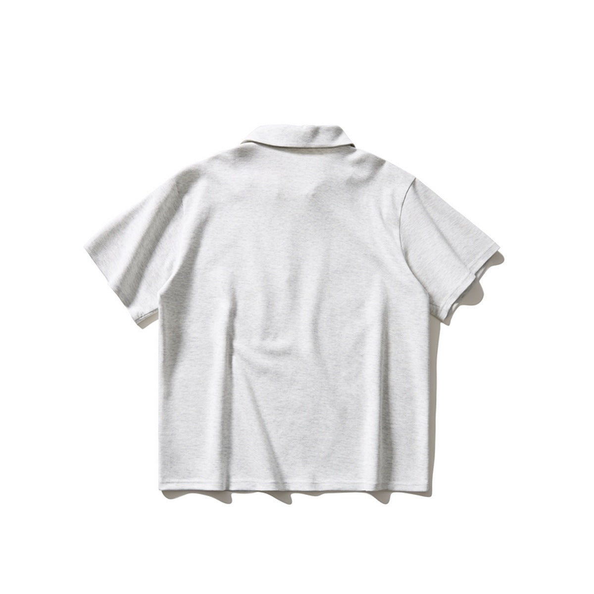 Back view of light heather gray short-sleeve polo shirt with collar, flat lay