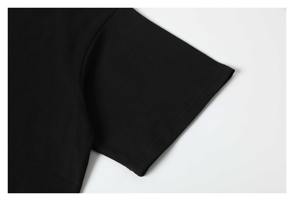 Close-up of a short sleeve and its stitched hem on the black T-shirt.