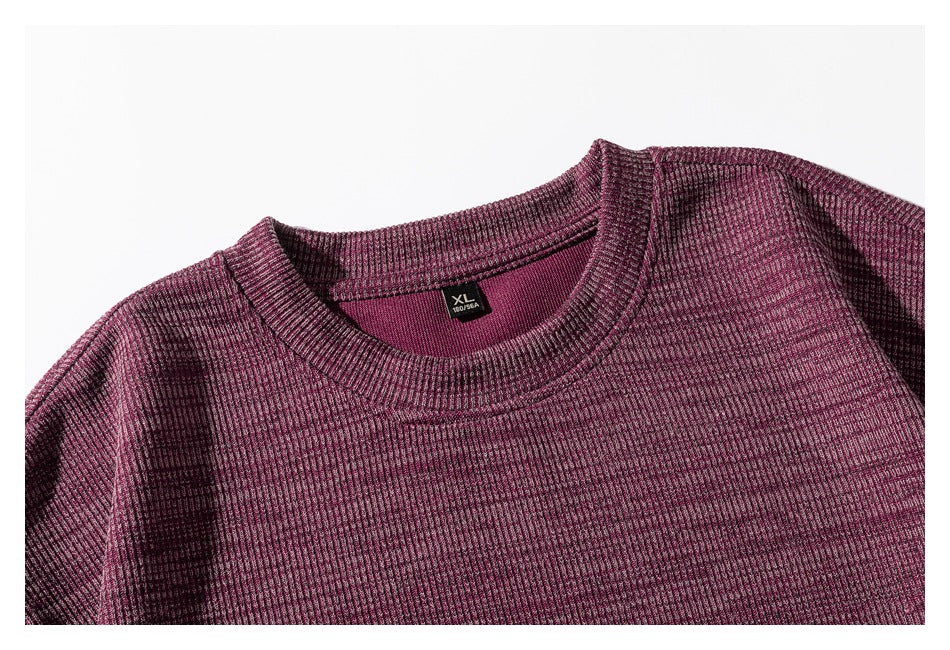 Close-up of the burgundy shirt's ribbed crew neckline and inner XL size label.