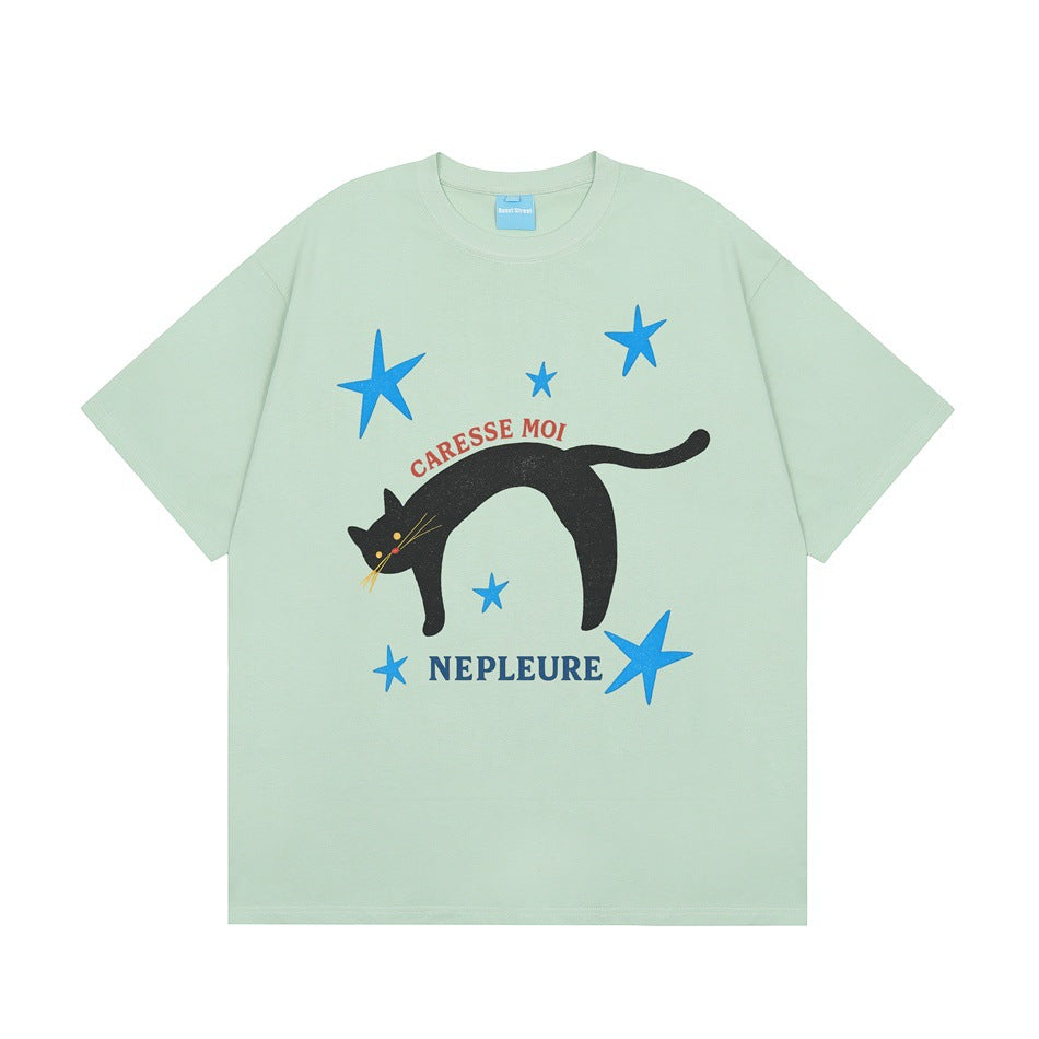Mint green short-sleeve T-shirt with black cat, blue stars and CARESSE MOI NEPLEURE print, flat front view