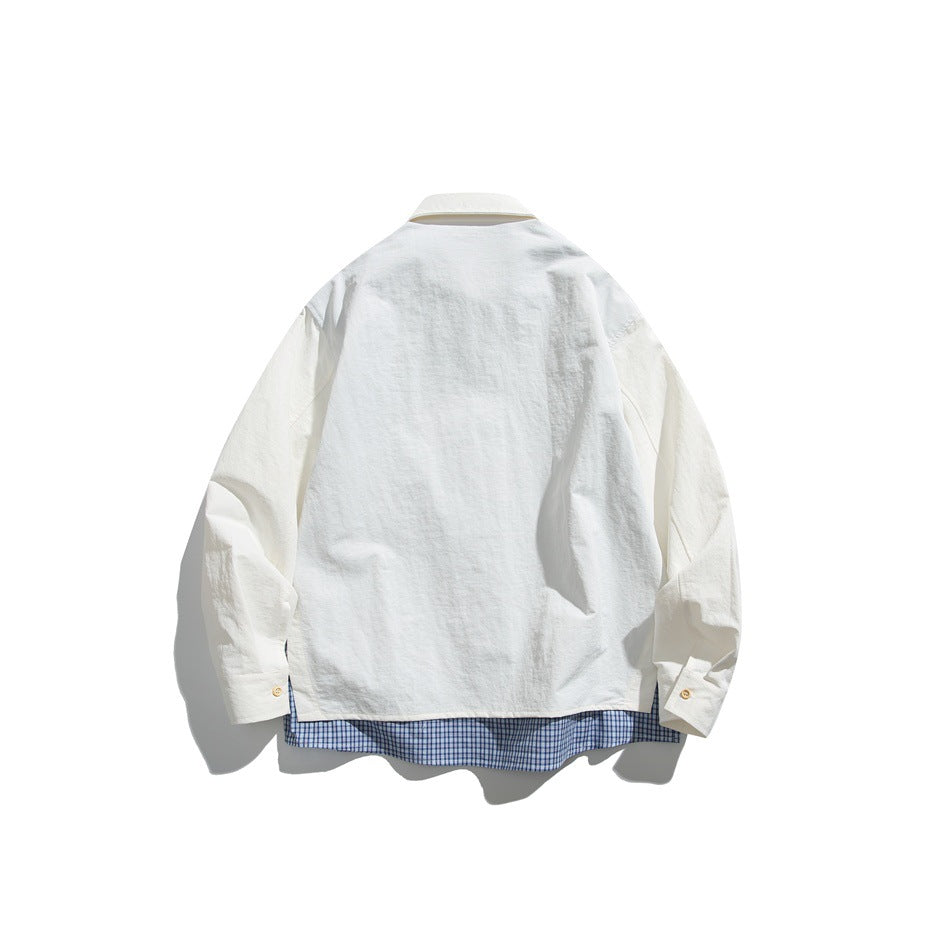 Back view of an off-white long-sleeve button-up shirt with blue checked fabric showing below the hem.