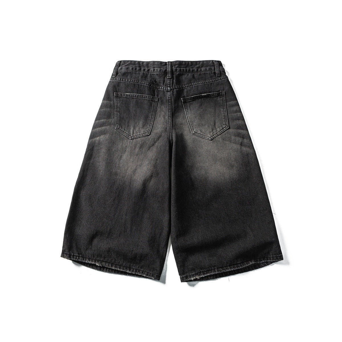 Back view of black washed denim shorts with a wide-leg cut and two rear pockets, laid flat on white.