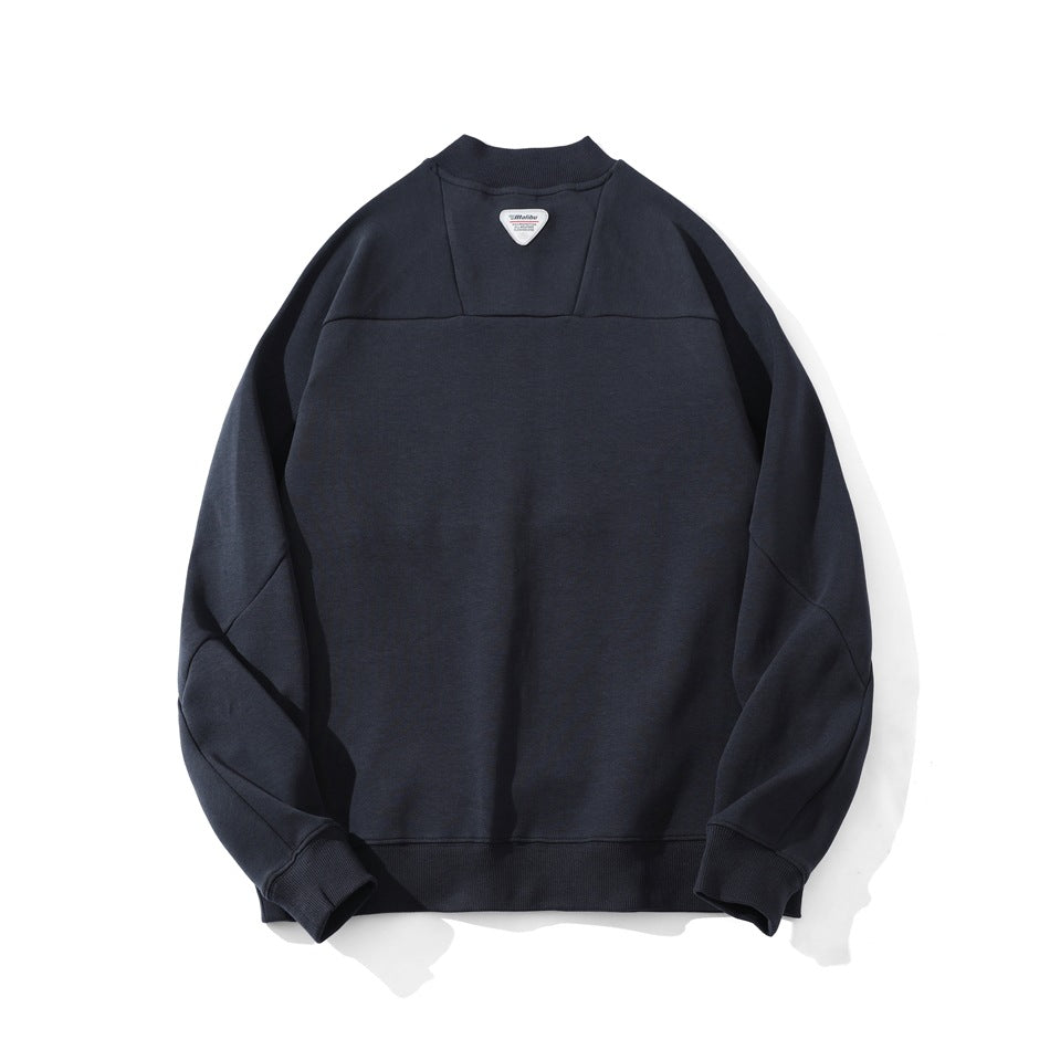 Flat lay of the back of a dark navy sweatshirt, showing a yoke seam, raglan sleeves, and ribbed trim.