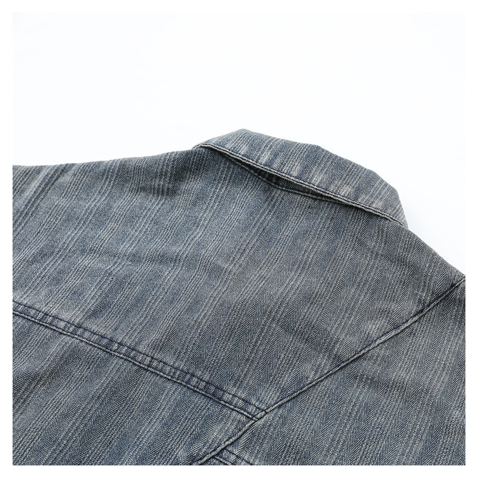 Cropped back view showing the collar and upper yoke of a gray-blue striped jacket.