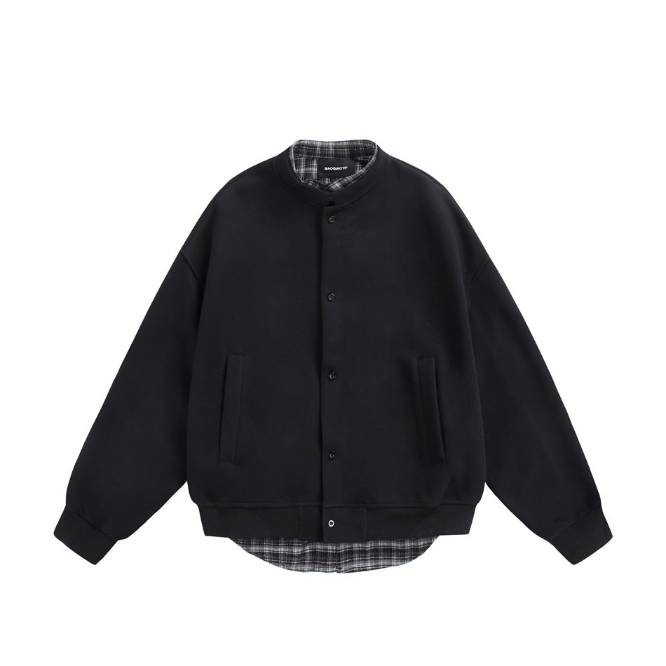 Black button-front jacket with stand collar, ribbed cuffs and hem, and gray plaid layer at collar and hem