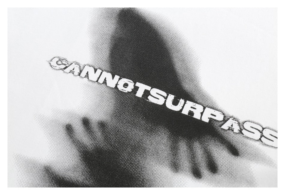 Close-up of a black-and-white shirt graphic with bold English lettering.