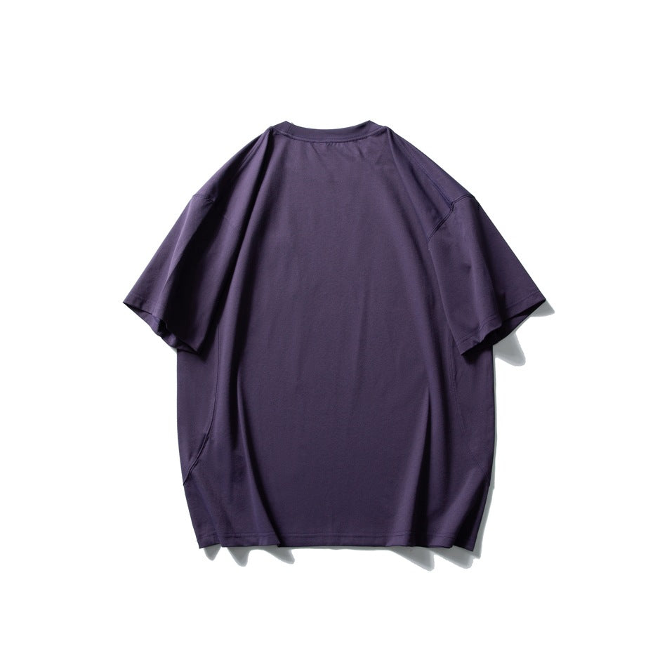 Back view of an oversized dark purple T-shirt with short sleeves on a white background.