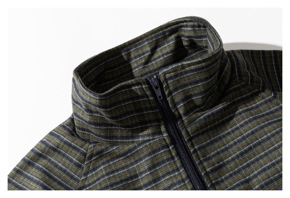 Close-up of the jacket’s striped stand collar and black front zipper.