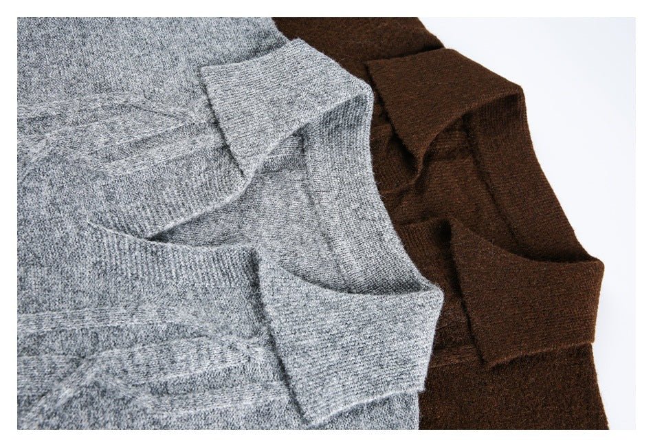 Close-up of gray and dark brown cable-knit sweaters, showing folded knit edges and texture.