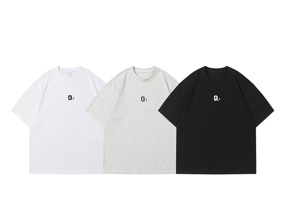 Three short-sleeve T-shirts in white, heather gray and black, each with a small Q graphic on the chest