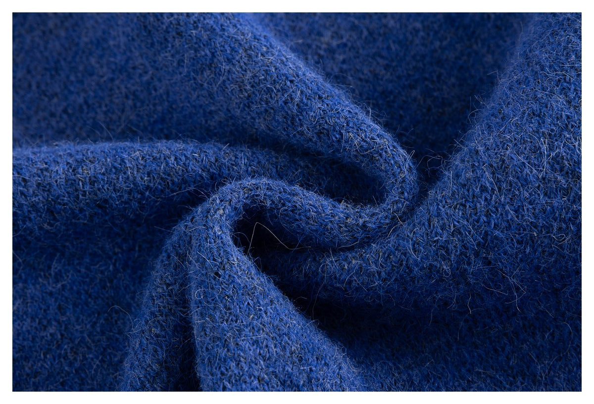 Macro view of the fuzzy blue knitted fabric texture.