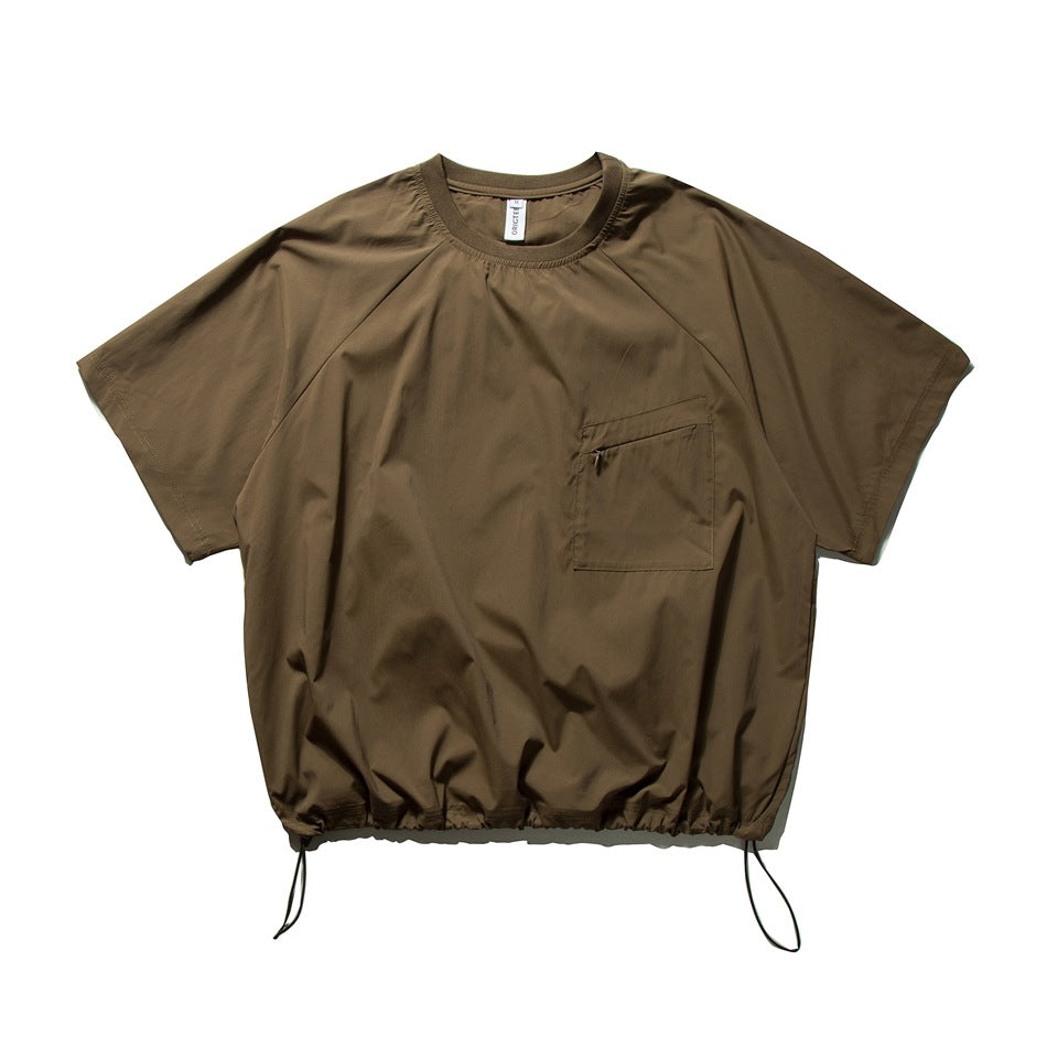 Coffee brown short-sleeve crew-neck top with raglan sleeves, zip chest pocket and drawcord hem, flat lay front view