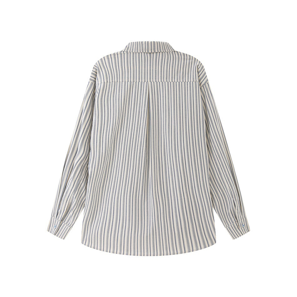 Flat-lay back view of a cream button-up shirt with narrow blue-gray vertical stripes, a yoke, and a center pleat.