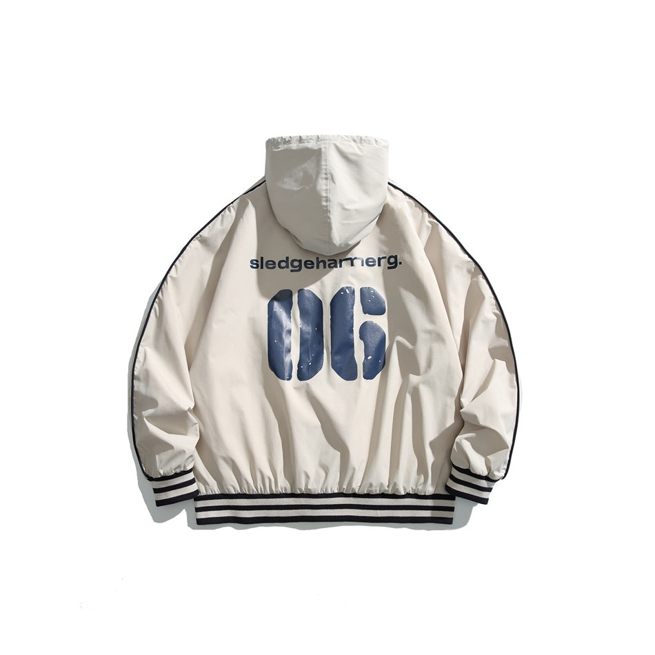 Back view of an off-white hooded jacket with dark piping and striped ribbed cuffs and hem, printed with navy graphics.