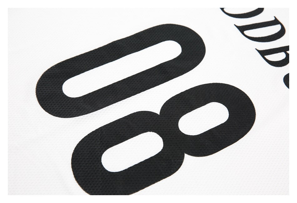 Close-up of white mesh jersey fabric with a large black number 08 and partial black lettering.