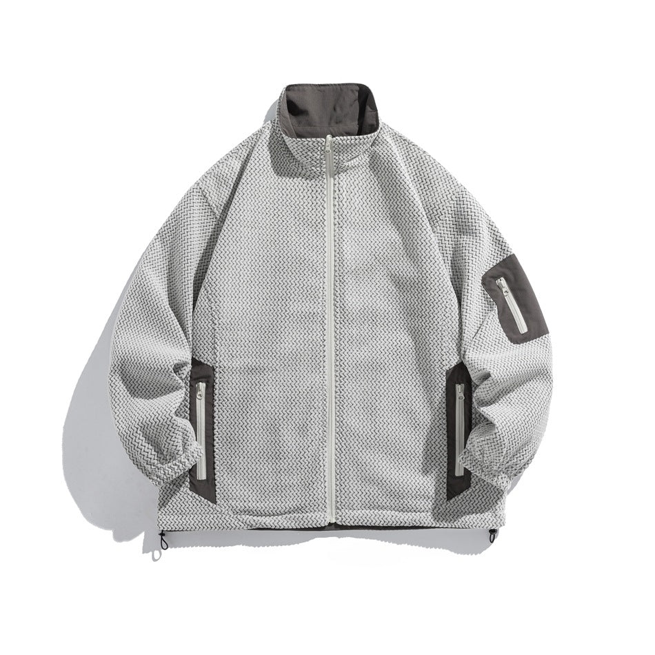 Light gray textured zigzag-weave stand-collar zip jacket with gray contrast panels and zippered pockets, flat lay