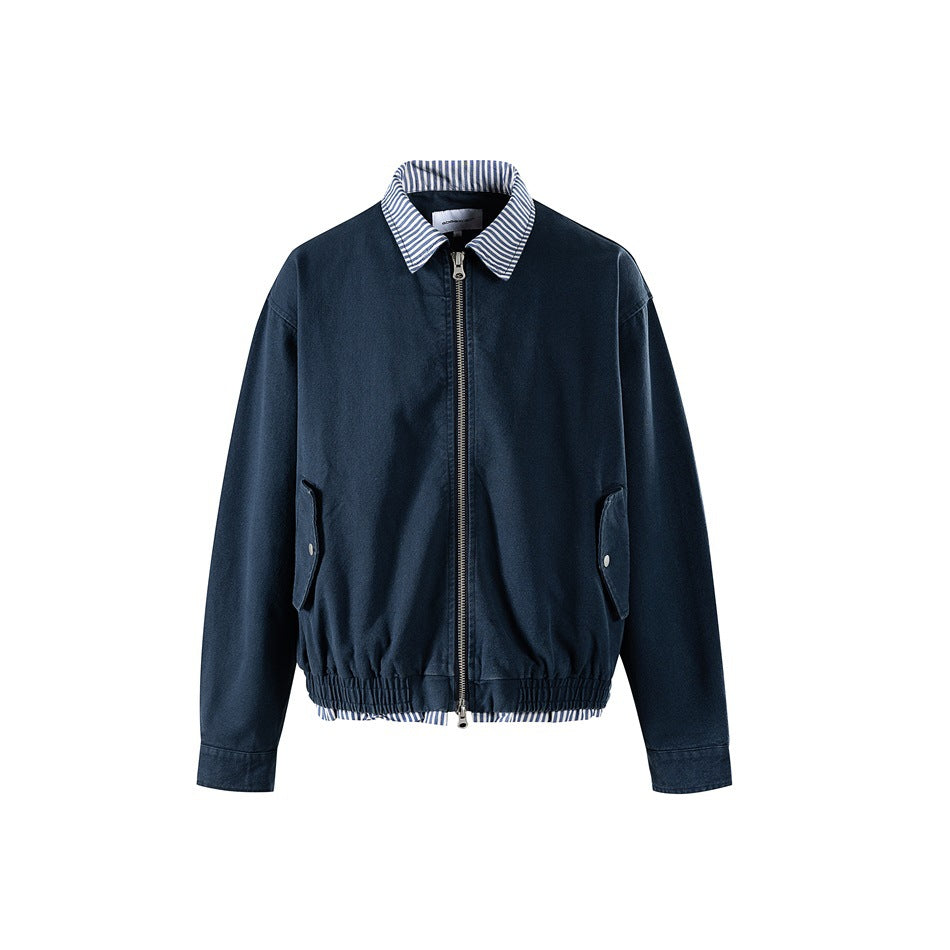 Navy zip-front jacket with striped collar, flap pockets and elastic hem with striped layered trim, front view